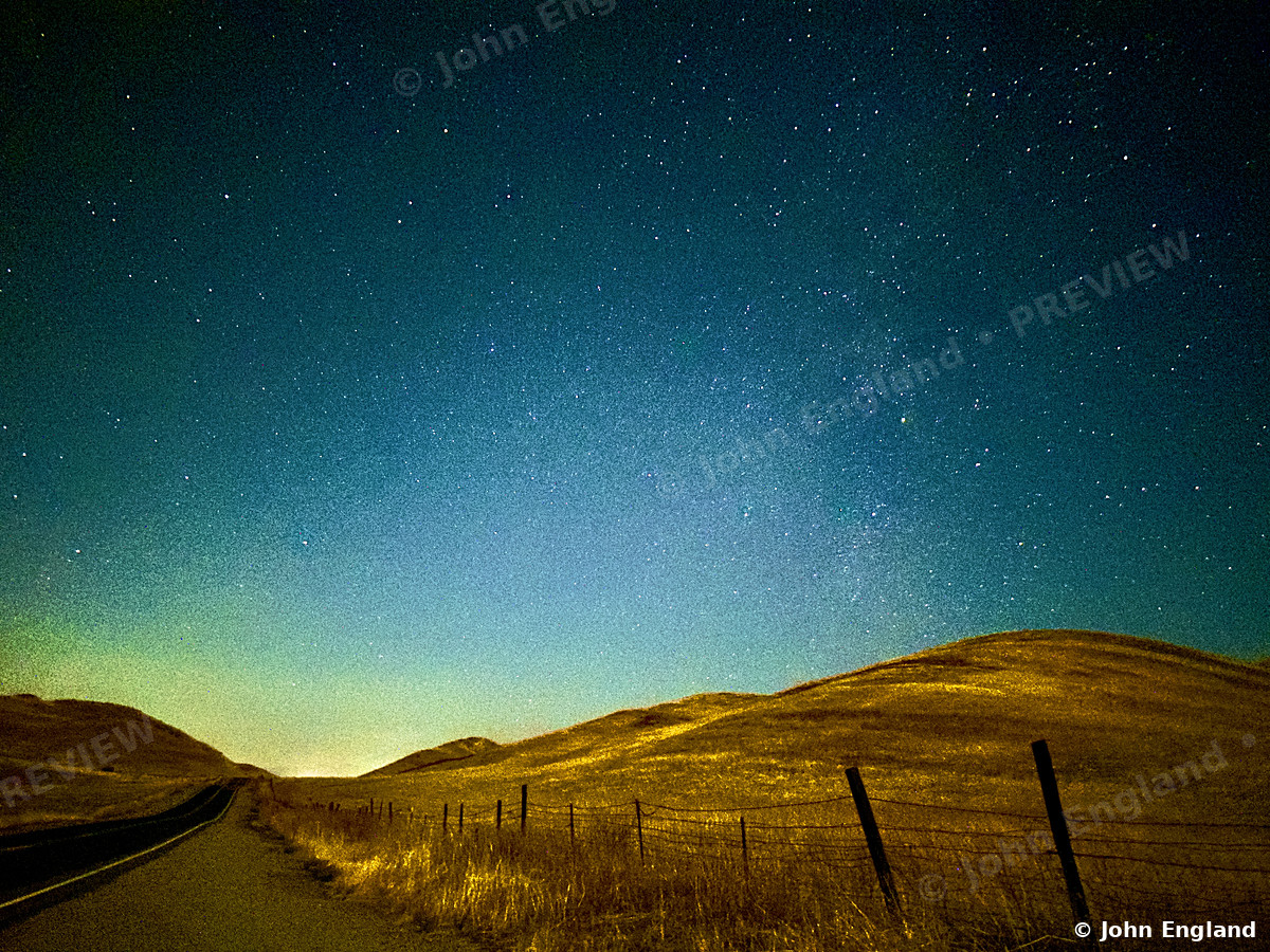 Milky Way over Golden Foothills – Milky Way over golden foothills and a fence line, Northern California. Oct 2023. John England.