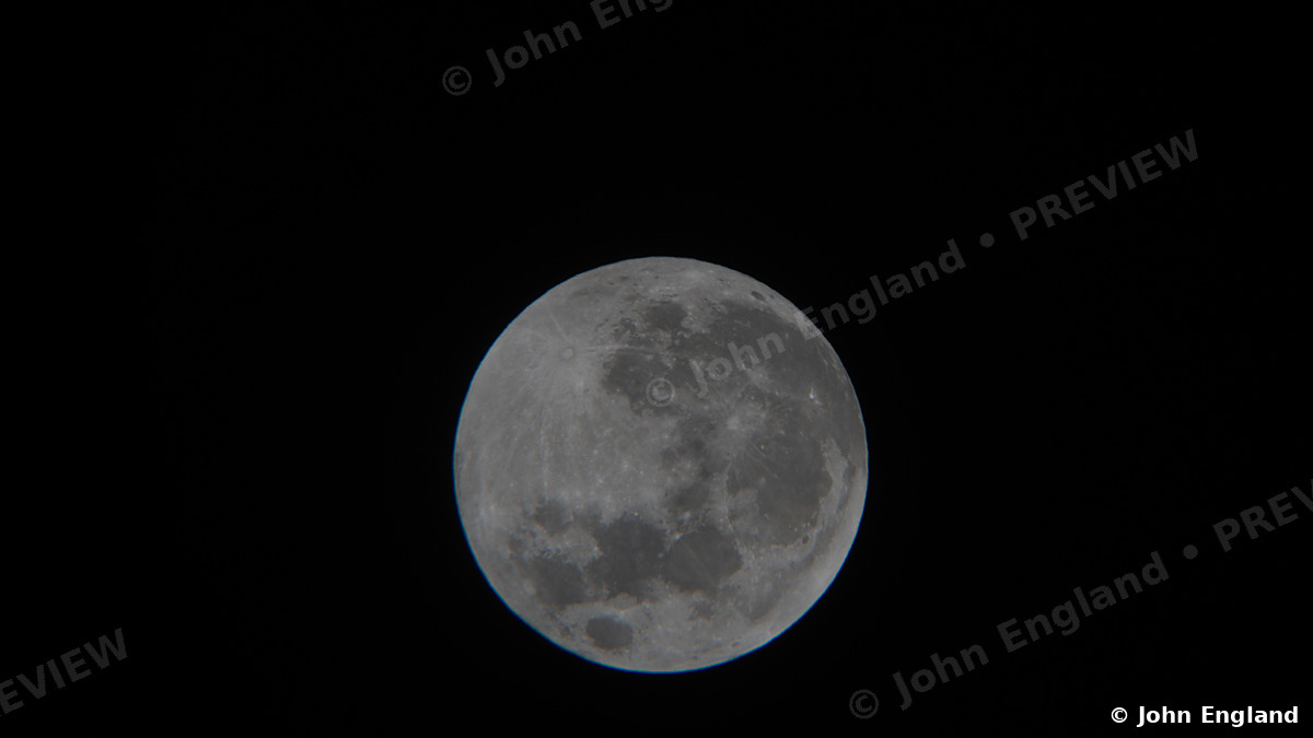 Small Full Moon – Full moon on black sky.