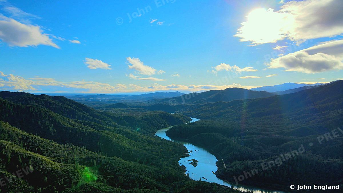 River Through the Mountains – River winding through a mountain valley.
