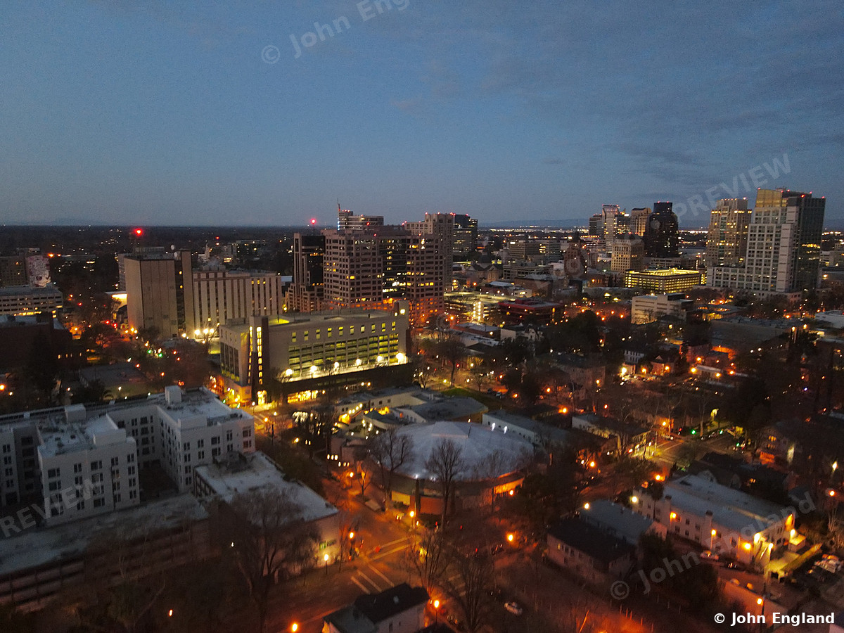 Blue Hour over Midtown – Aerial blue-hour with warm streetlights.