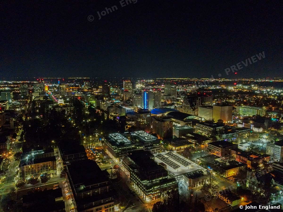 City Grid at Night – Aerial night view over the Sacramento grid toward the downtown towers.