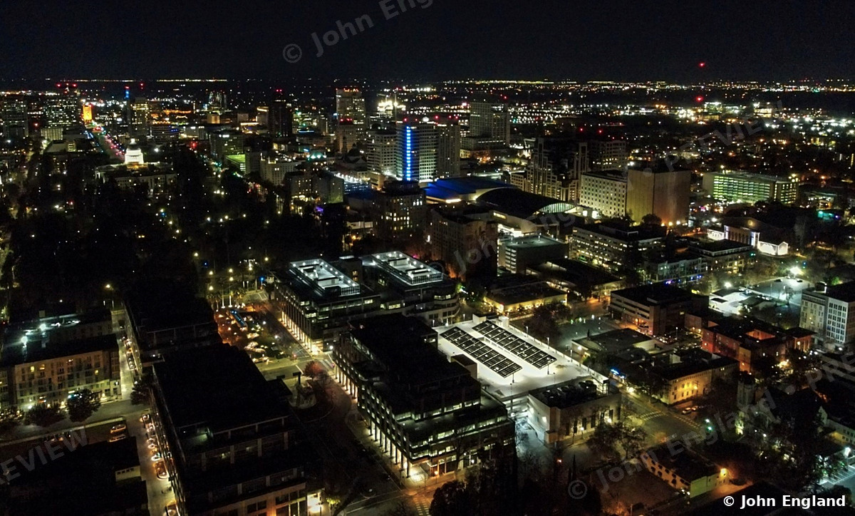 Night Streets from Above – Drone view of lit city blocks at night, Sacramento.