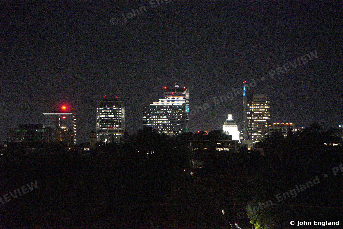 Sacramento Skyline with Capitol Dome at Night – Downtown skyline at night across the trees, May 17, 2021.