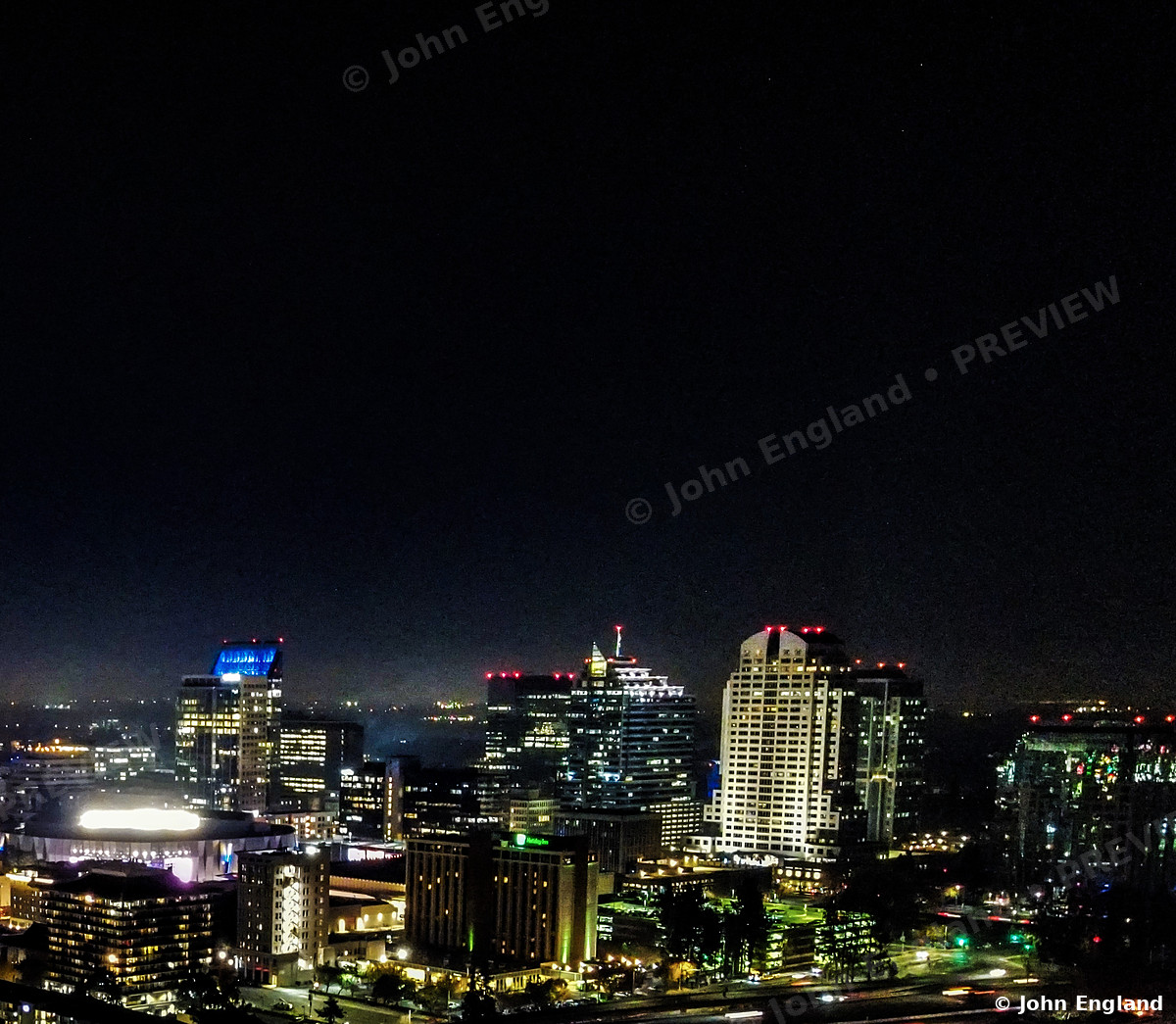 Skyline Lights at Night – Aerial night skyline with lit towers.