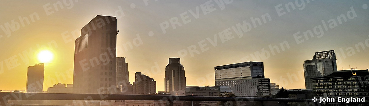 Skyline Sunburst – Sun over a downtown skyline, Mar 9, 2021.