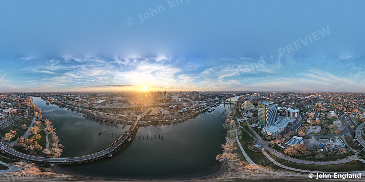 Sunrise River Planet Panorama – 360 drone panorama at sunrise over the river and city.