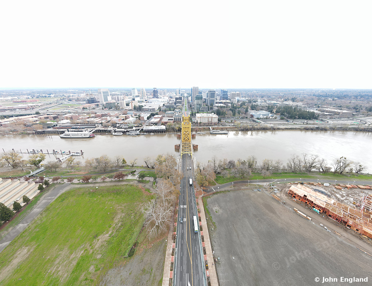 River and Bridge Aerial, Sacramento – Drone view down Tower Bridge across the Sacramento River toward downtown Sacramento. Dec 16, 2021. John England.