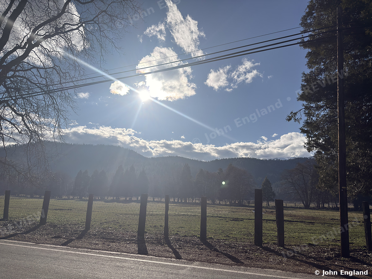 Winter Sun Over the Pasture, Northern California – Winter sunburst over a fenced pasture and forested hills in Northern California. Mar 2, 2026. John England.