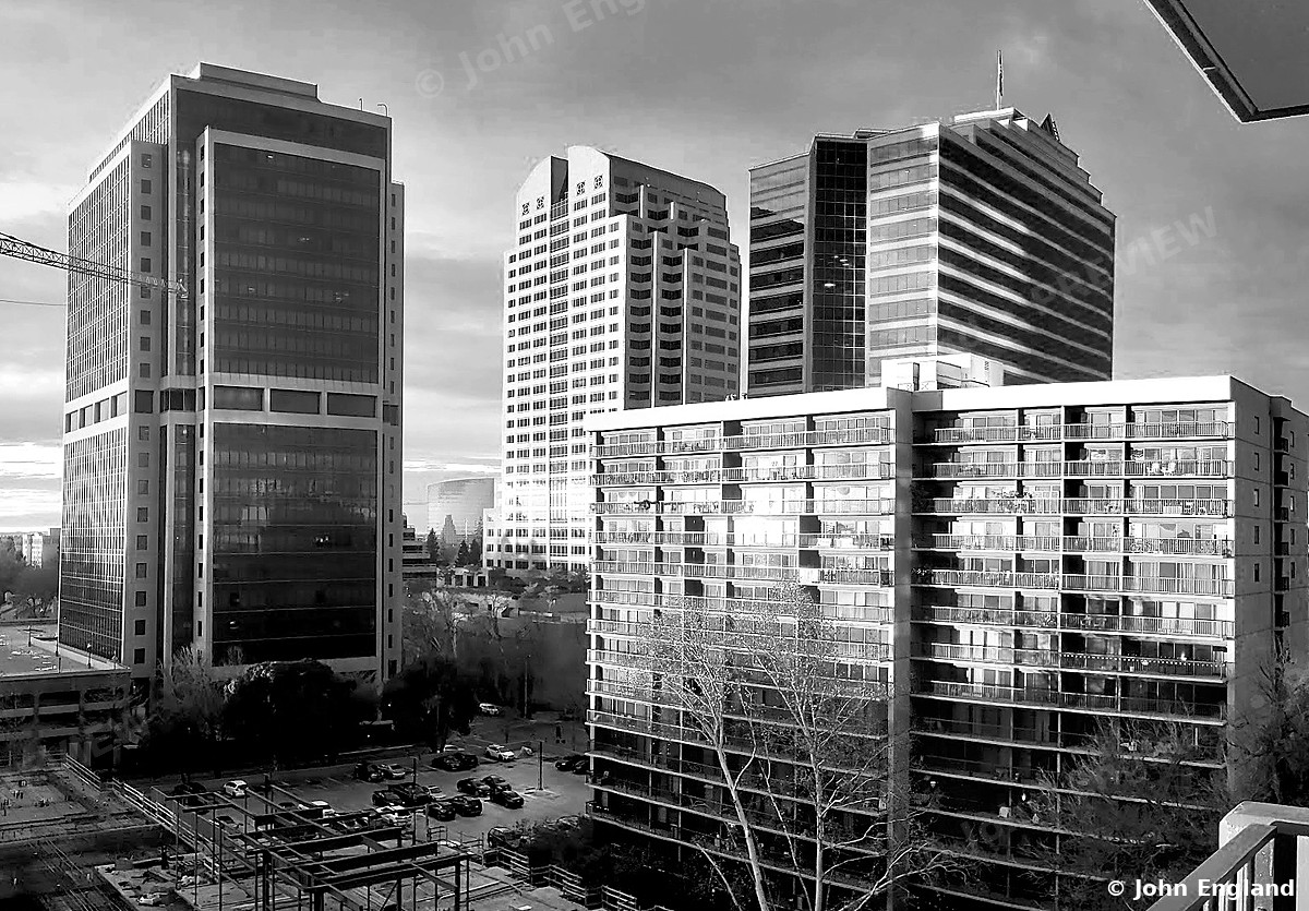 High-Rise Towers in Black and White – Black-and-white view of downtown high-rise towers. John England.