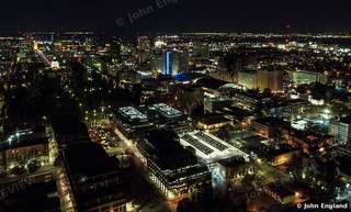 Night Streets from Above – Drone view of lit city blocks at night, Sacramento.