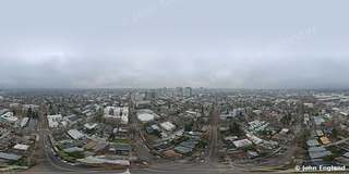 Overcast Aerial – Overcast aerial city view.