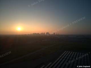 Railyards Sunrise Toward Downtown – Drone view at sunrise toward the downtown Sacramento skyline over the Railyards, Dec 2021.