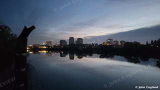 Sacramento Skyline Reflected at Dawn – Sacramento skyline reflected in the river at dawn, Sacramento, CA. Nov 26, 2021. John England.