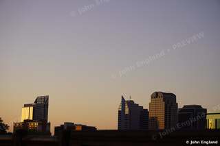Sacramento Dawn Skyline – Sacramento towers silhouetted against an amber dawn sky.