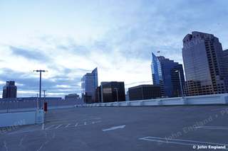 Sacramento Skyline at Dawn – Downtown Sacramento skyline at dawn under pink and gold clouds, CA. Feb 2021. John England.
