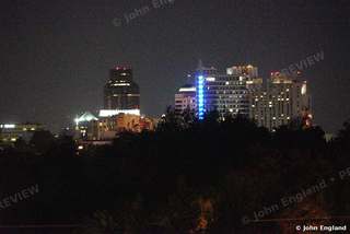 Sacramento Skyline at Night, Blue Tower Lights – Downtown skyline at night across the trees, May 17, 2021.