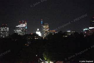 Capitol Dome Among the Night Towers – Downtown skyline at night across the trees, May 17, 2021.