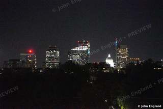 Sacramento Skyline with Capitol Dome at Night – Downtown skyline at night across the trees, May 17, 2021.
