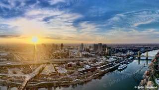 Sunrise over the Sacramento River and Downtown – Aerial sunrise over the Sacramento River and downtown Sacramento, CA. Feb 2022. John England.