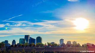Sunrise Over Skyline – Sunrise over a city skyline. Oct 19, 2021. John England.