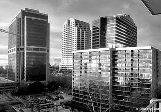 High-Rise Towers in Black and White – Black-and-white view of downtown high-rise towers. John England.